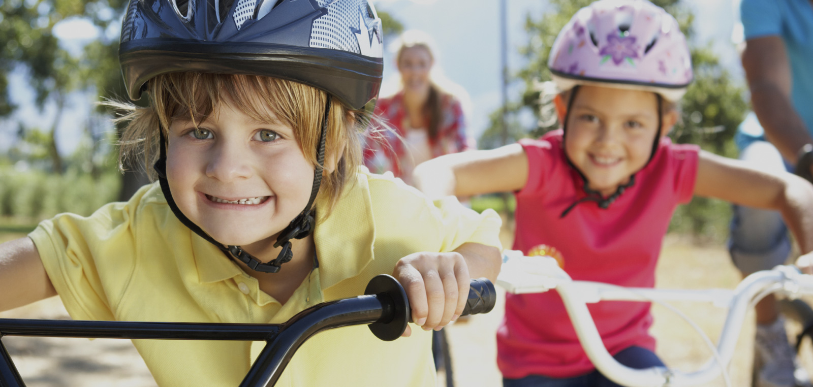 kids riding bikes smiling